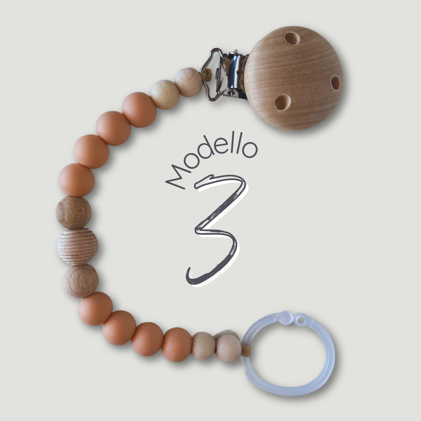 Catenella portaciuccio in legno e silicone, colore peach, perla centrale rigata.