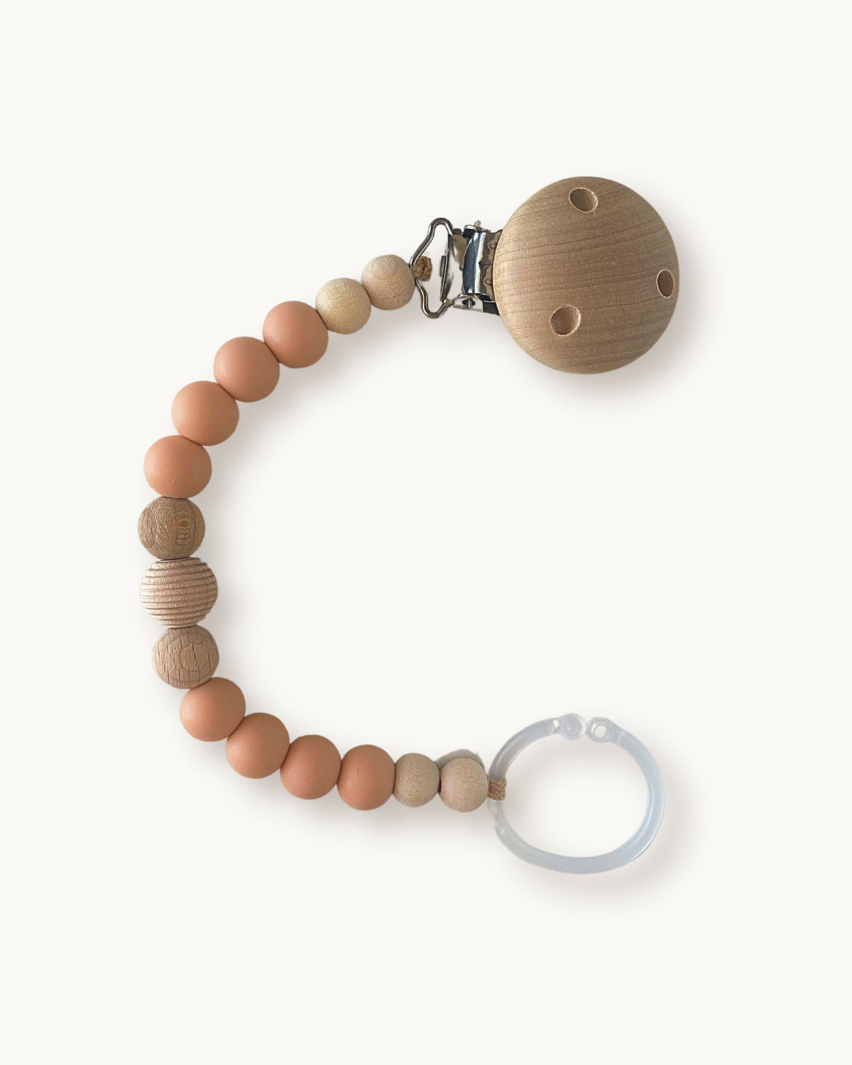 Catenella portaciuccio in silicone tonalità pesca con perle in legno e anello per ciuccio.