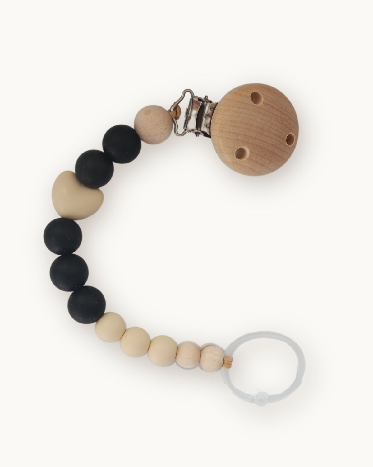 Catenella portaciuccio in silicone alimentatare nero e beige con sfere e perla a cuore in legno naturale.