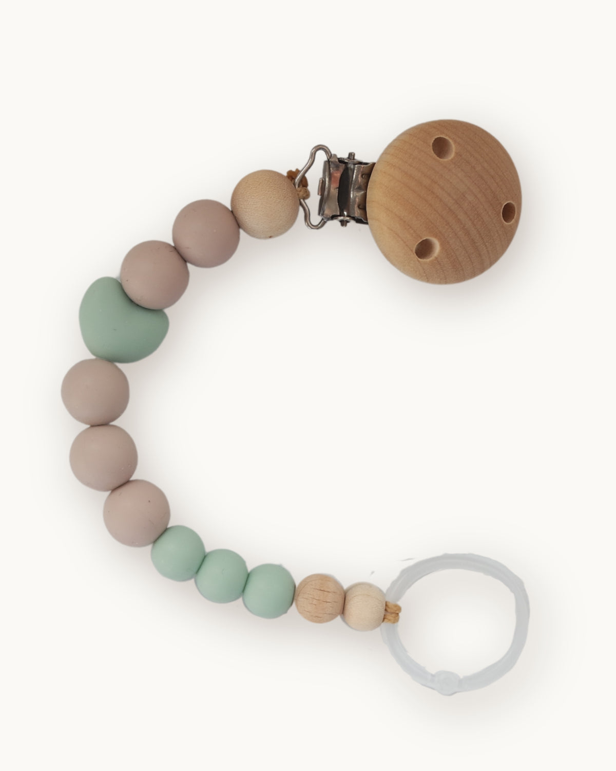 Catenella portaciuccio in silicone verde salvia e marrone rosé con elemento a cuore e anello trasparenti per ciuccio.