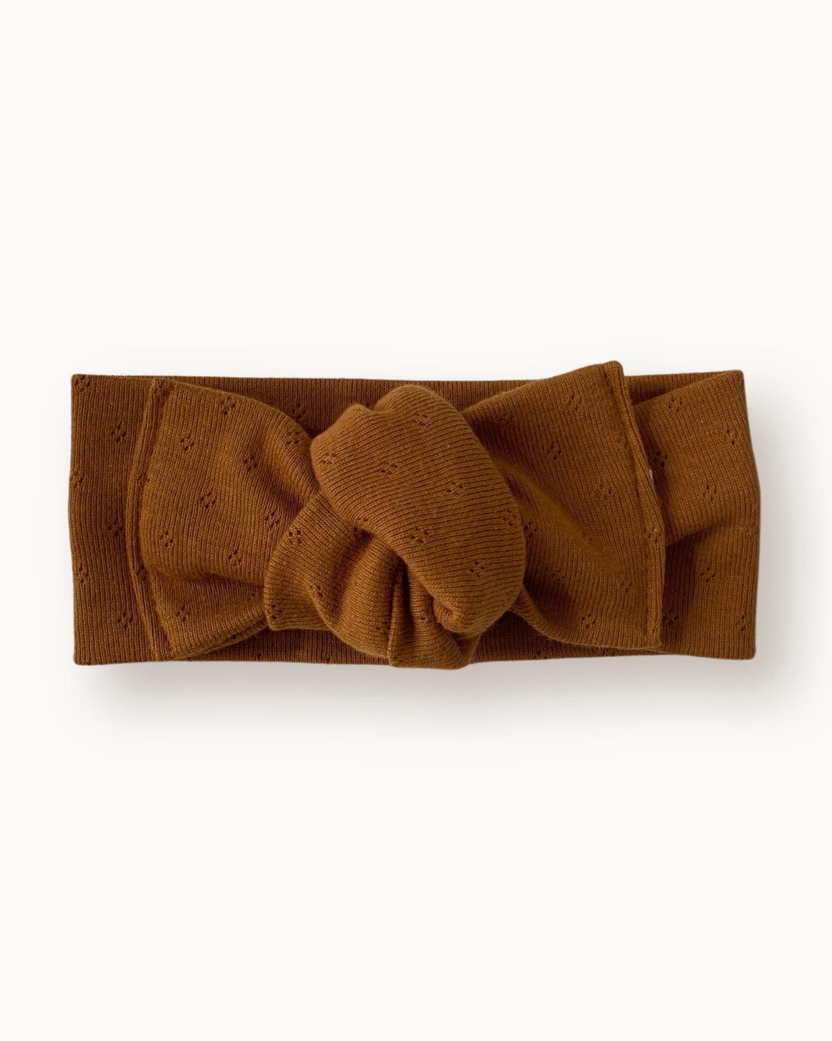 Fascia per capelli neonata con nodo in jersey di cotone pointelle colore caramello