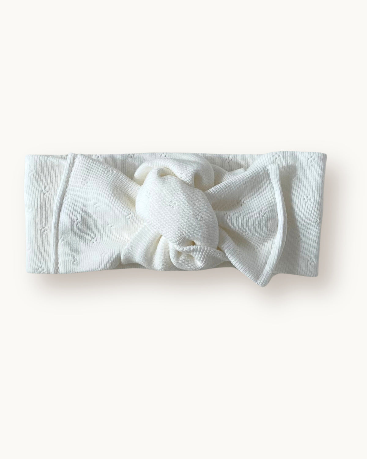 Fascia per capelli neonata con nodo in jersey di cotone pointelle colore bianco panna