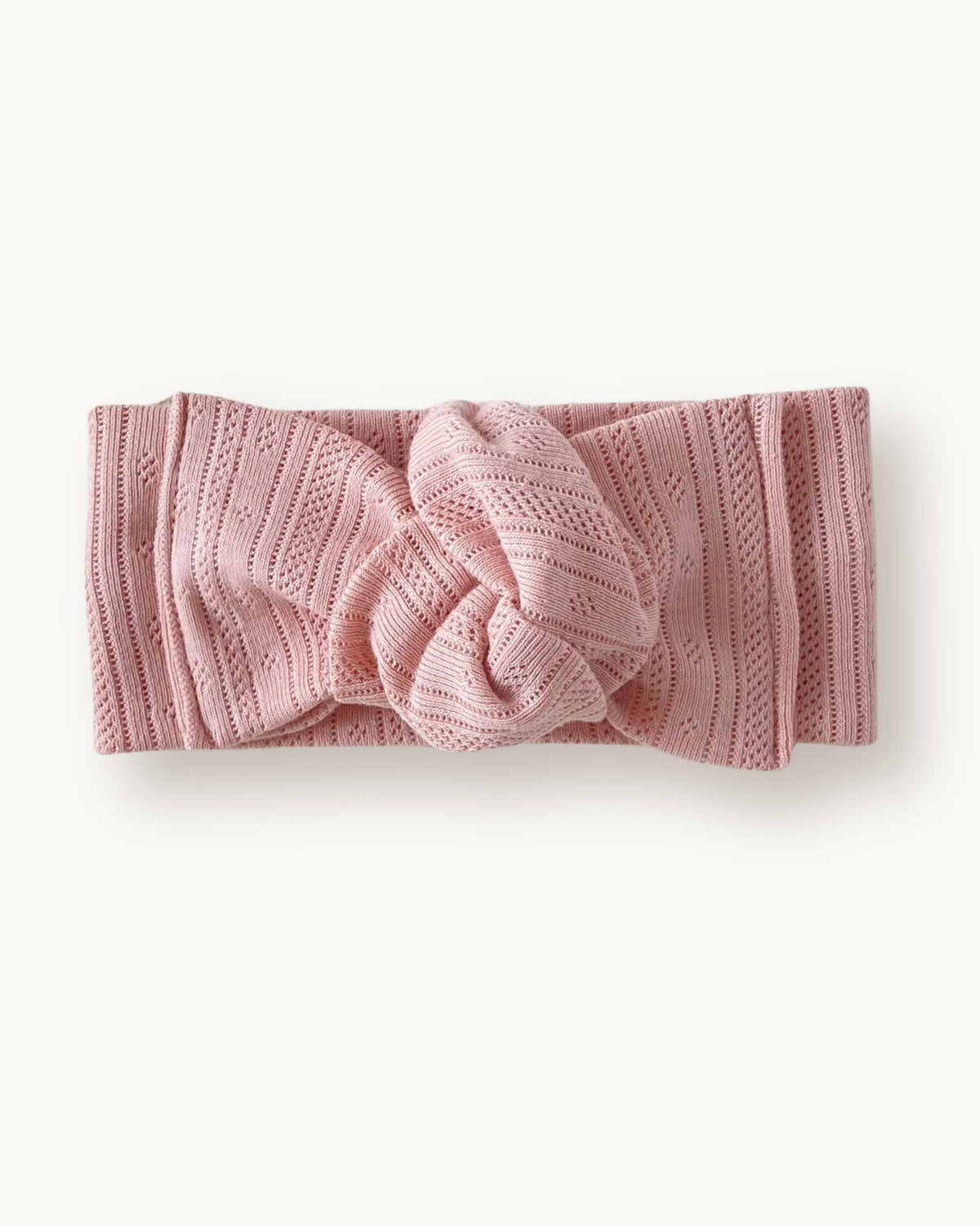 Fascia per capelli neonata con nodo in jersey di cotone pointelle e stripes colore rosa cipria