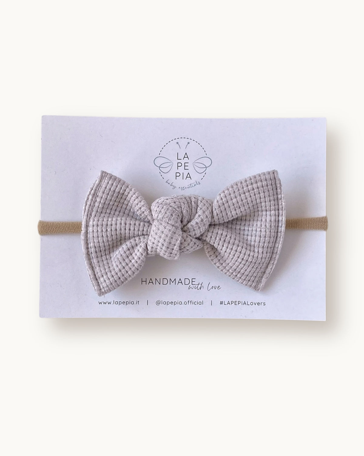 Maxi fiocco per capelli da bambina e neonata Maxi Grace beige su fascia morbida in nylon.