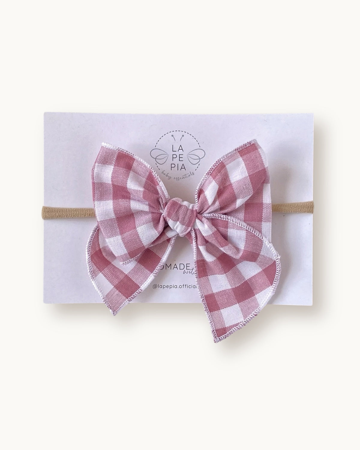 Fiocco per capelli a quadretti vichy rosa vintage su fascia elasticizzata per neonata e bambina, in puro cotone.